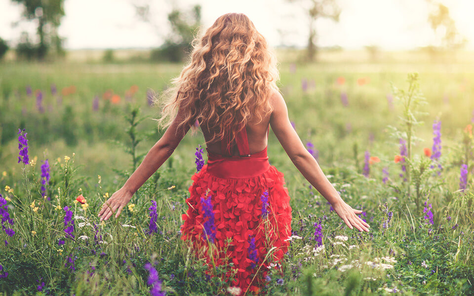 Girl in field of flowers